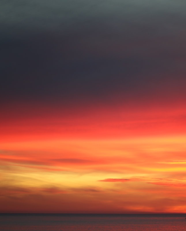 The Sky Caught Fire and Forgot the Sea