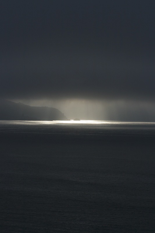 Light Breaking Through Storm Over Sea